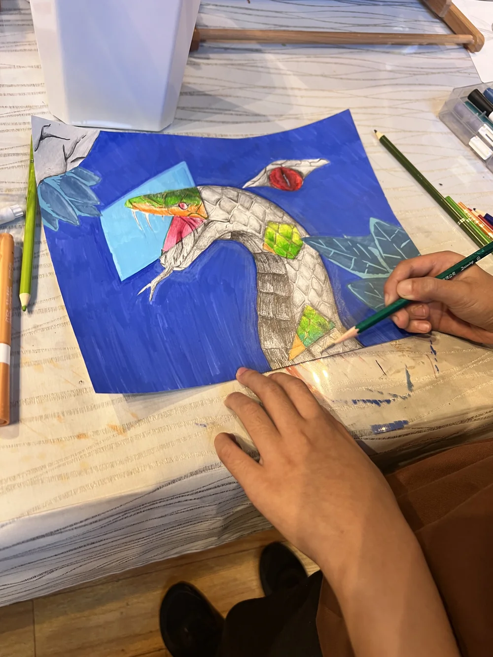 Student drawing with colored pencil
